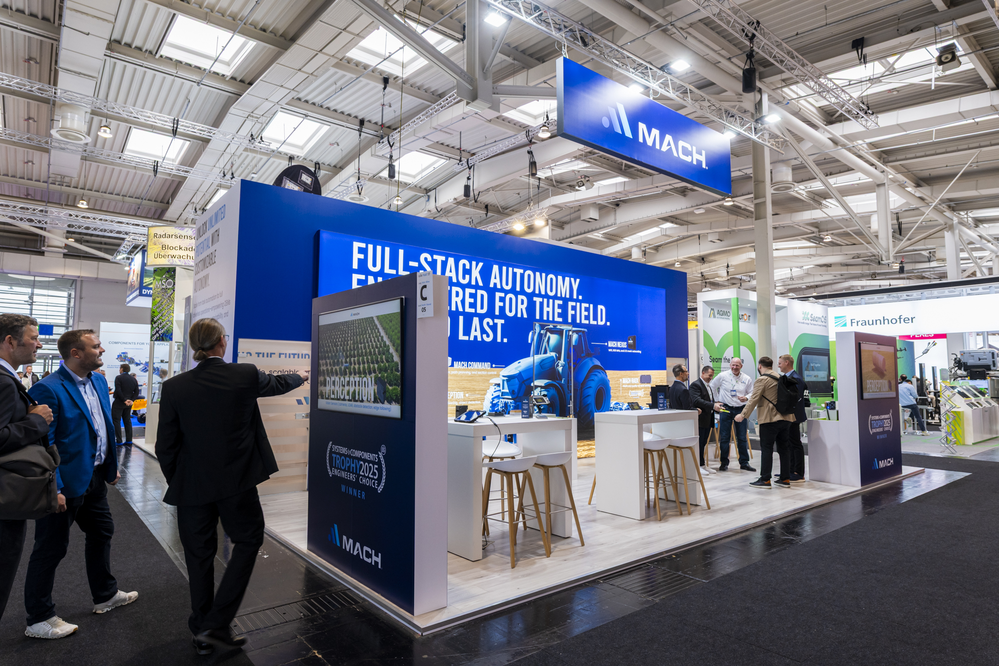 Mach team presenting the autonomy platform to OEM visitors at Agritechnica 2025