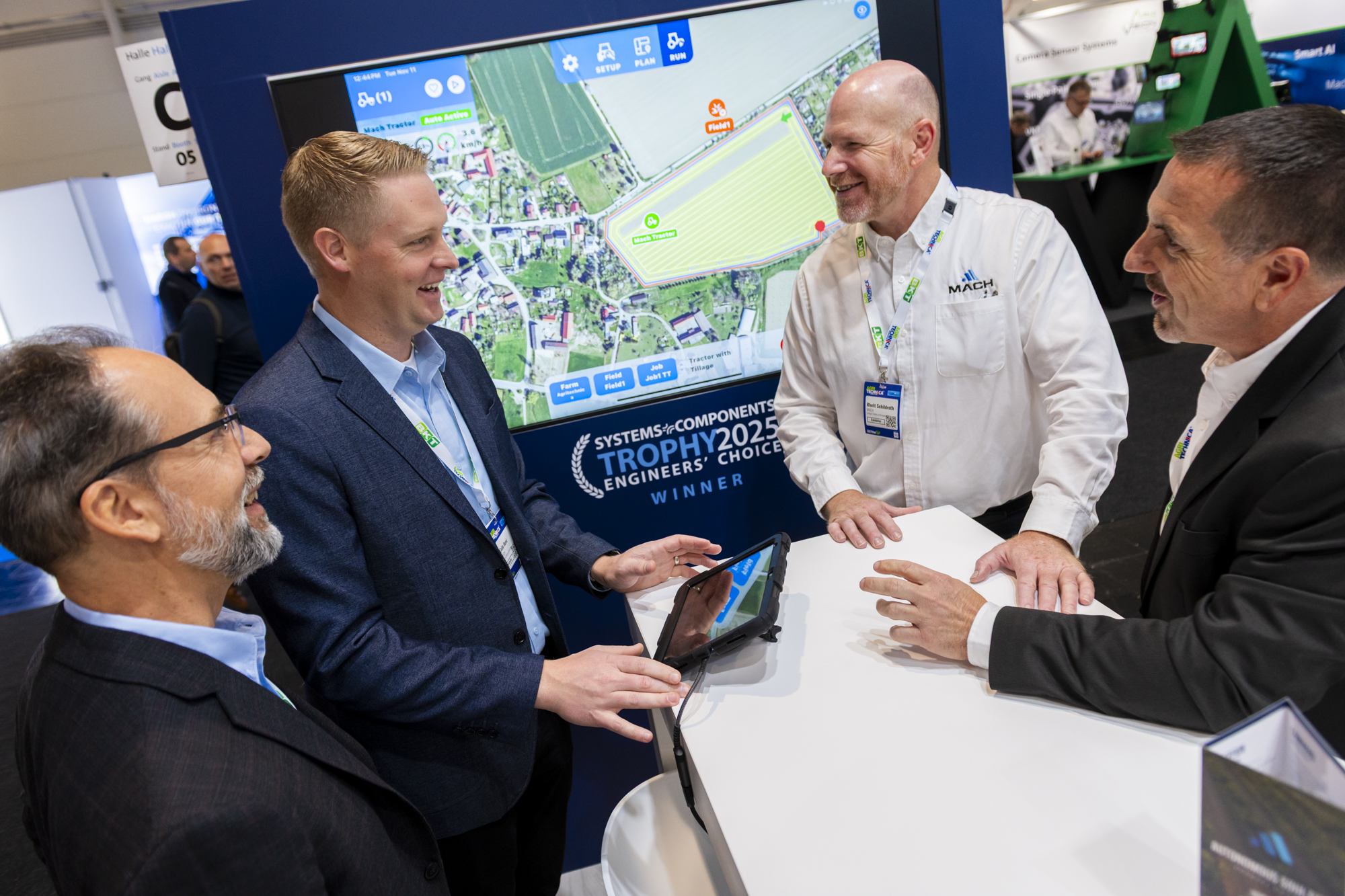 Mach team presenting the autonomy platform to OEM visitors at Agritechnica 2025
