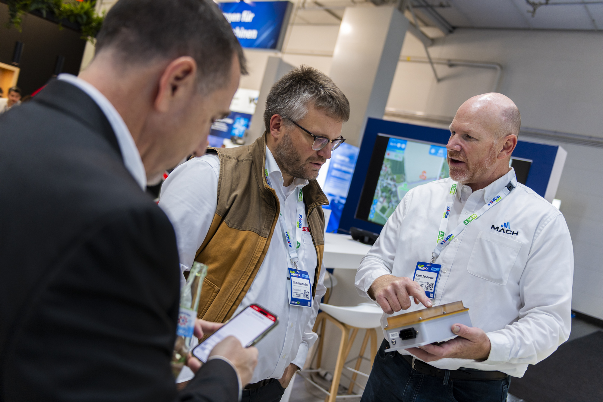 Mach team presenting the autonomy platform to OEM visitors at Agritechnica 2025